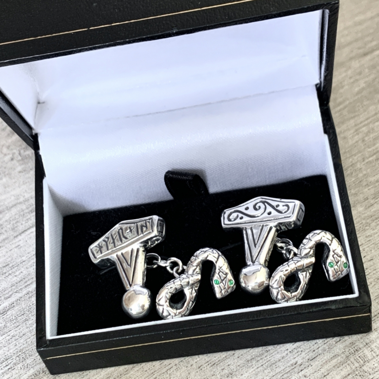 Sterling Silver Cufflinks depicting Thor's Hammer and Thor's sworn enemy Serpent. The hammers are replicas of the original 10th Century amulet unearthed in recent years during an archeological dig in Denmark